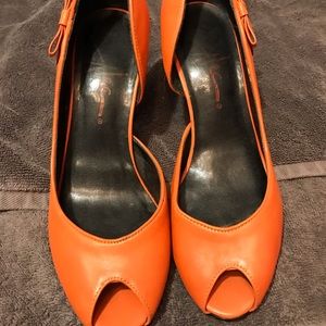 Orange heels from New Orleans Boutique